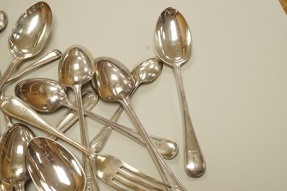 A harlequin part canteen of late Victorian and Edwardian silver beaded Old English pattern flatware, various dates and makers, comprising thirty items, 55.8oz.